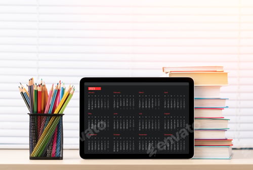 Preview: Tablet with 2023 calendar, pencils and books