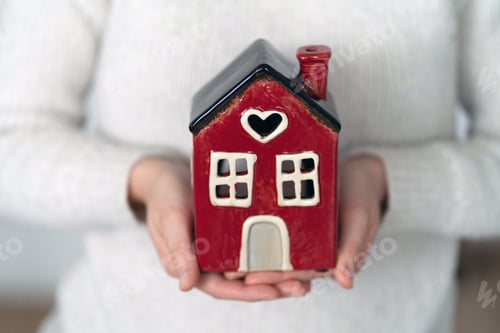 Preview: Holding the model house, real estate insurance and banking concept