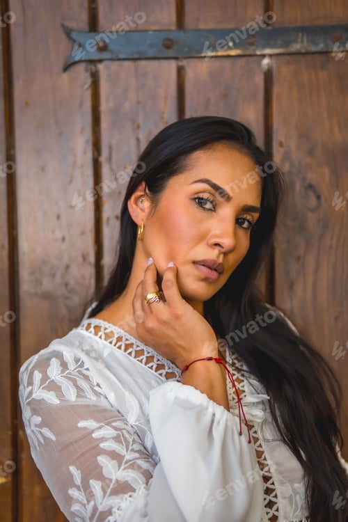 Preview: Portrait of the young pretty girl with a background of a wooden door