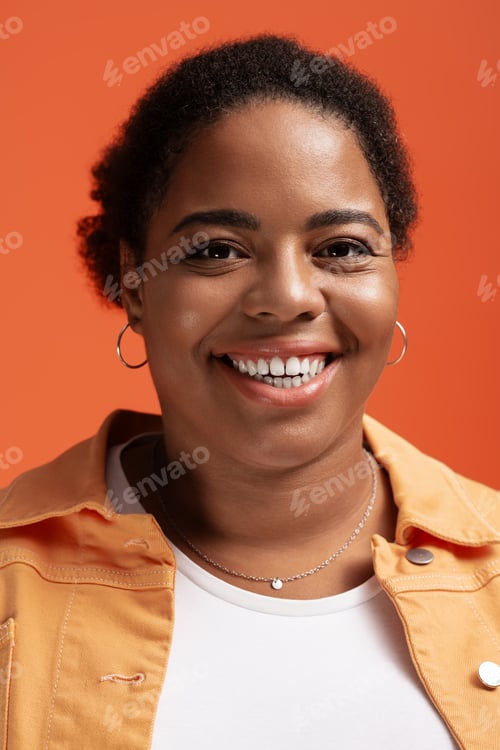 Preview: Stylish plus size woman showcases trendy autumn fashion in vibrant studio setting