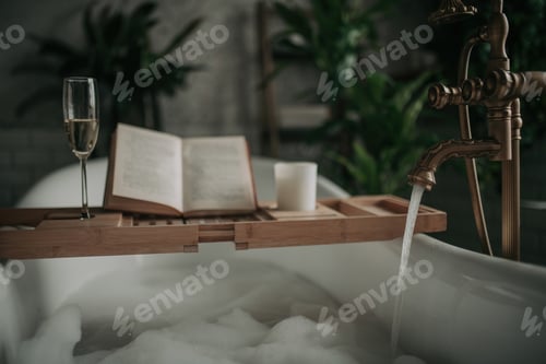 Preview: Luxury interior of eco style modern bathroom with oval bathtub and book on bamboo wood tray