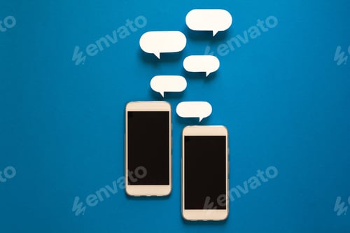 Preview: Smartphones with paper speech bubbles on blue background