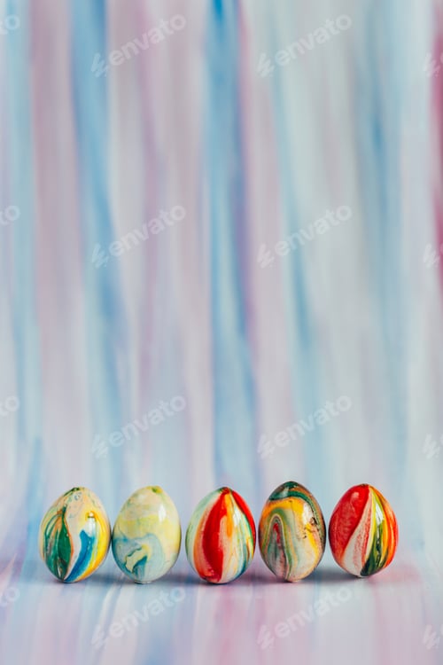 Colorful Marbled Easter Eggs on Striped Surface