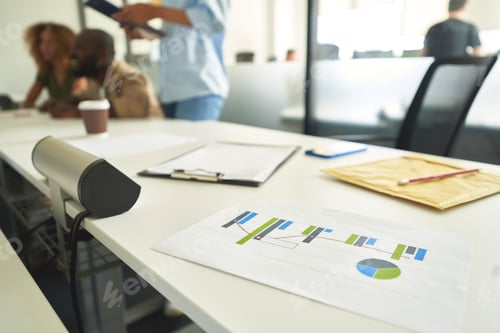 Preview: Wide office table with focused people working at it