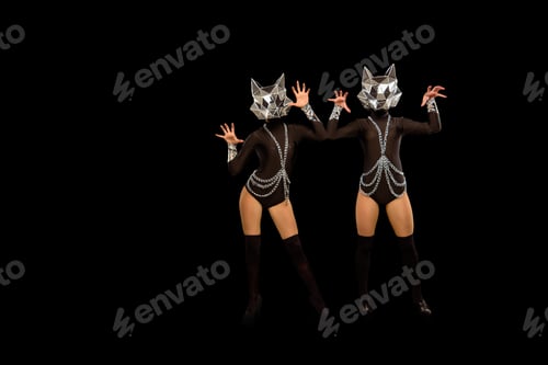 Preview: Two go-go variety show dancers in wolf masks on black