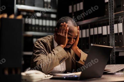 Preview: Exhausted african american investigator solving complex crime case
