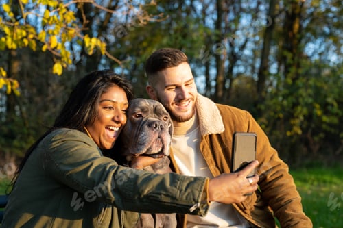 Preview: Young couple taking selfie with pet, people loves gods concepts