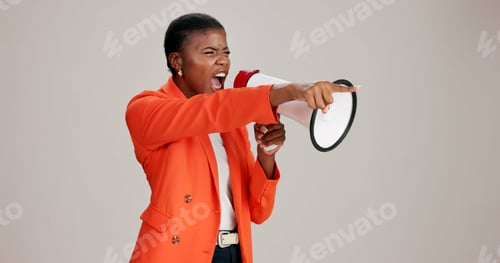 Preview: Black woman, angry and pointing in studio with megaphone, announcement and protest. Person, frustra