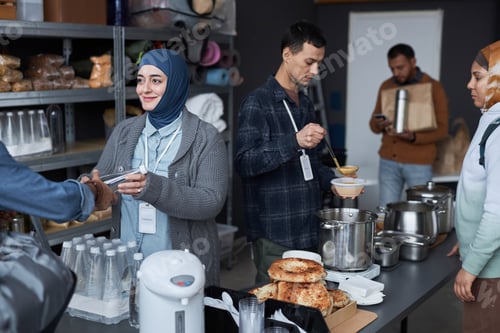 Preview: Group Of Middle Eastern People Volunteering at Refugee Help Center