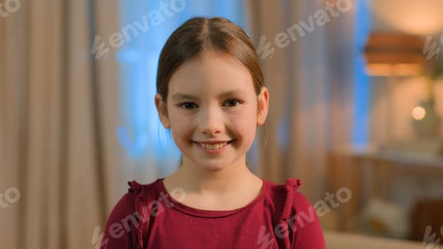 Preview: Portrait little Caucasian girl child daughter schoolgirl happy joyful toothy smiling female pupil