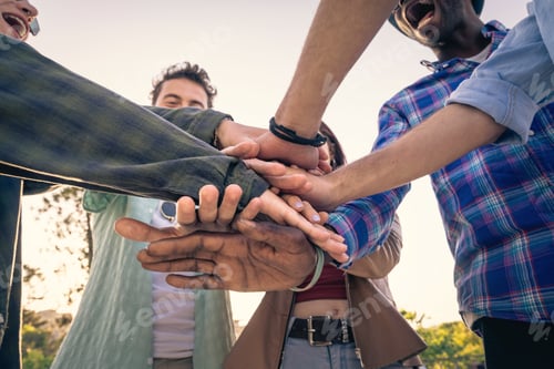 Preview: Close-up of diverse hands linked together in a circle, showing unity and trust.