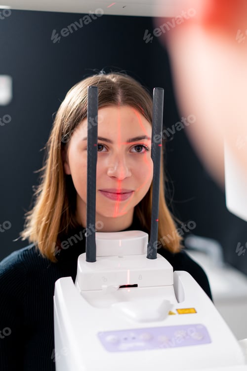 Preview: portrait of a beautiful woman doing a 3D scan of the nose and oral cavity in plastic surgery clinic