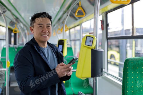 Preview: Happy and successful asian male passenger in public transport bought a ticket