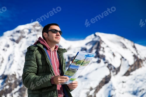Preview: Tourist on the background of snowy mountains
