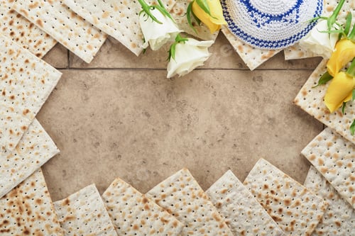 Preview: Passover celebration concept. Matzah, kosher red wine, walnut and white and yellow roses. Traditiona