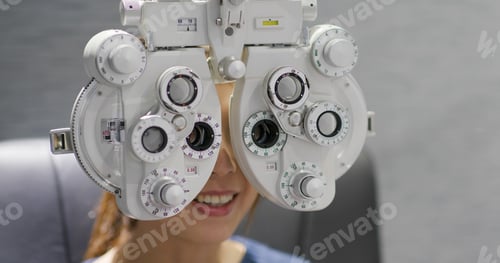 Preview: Woman checks her eye in clinic