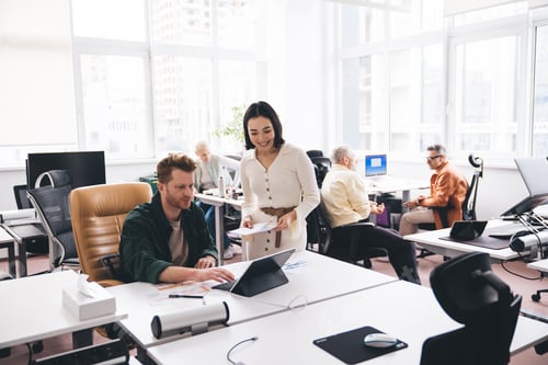 Preview: Colleagues working on project in office