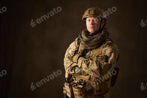 Preview: Serious Man in Military Gear with Arms Crossed