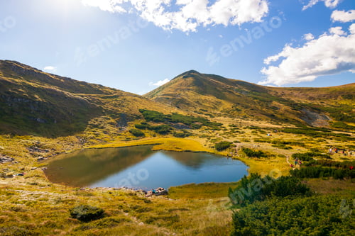 Preview: Panorama of Carpathian mountains in summer sunny day. Mountain lake