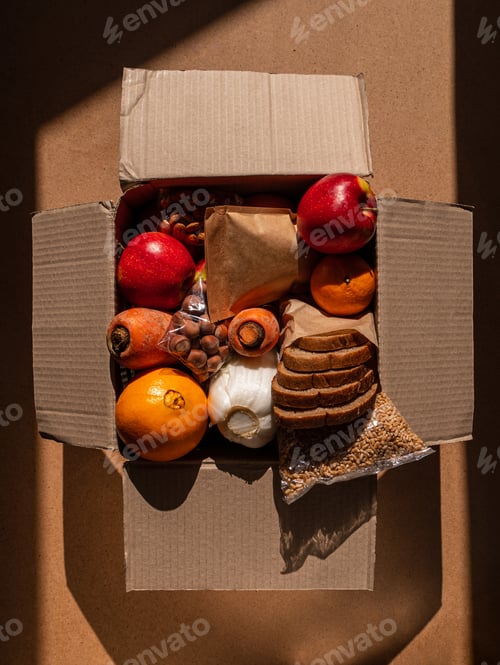 Preview: Healthy food delivery flat lay with harsh shadows. Take away products.Donation box online shopping