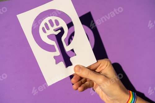 Preview: A woman holding a drawing in a vindication in favor of equality between men and women