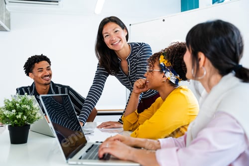 Preview: Business people collaborating on project in startup office meeting