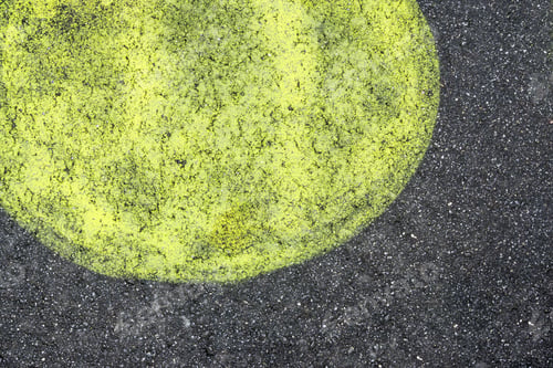 Preview: The Abstract Big Round Spot Of Lemon Color Is Represented On Black Asphalt