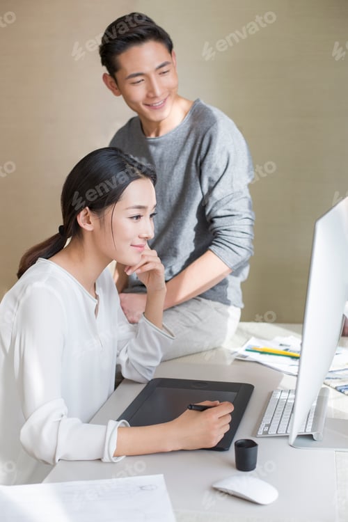 Preview: Young couple designing clothing together