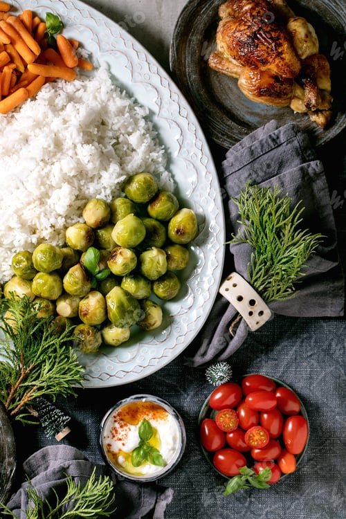 Preview: Christmas dinner table with grilled chicken, rice and vegetables