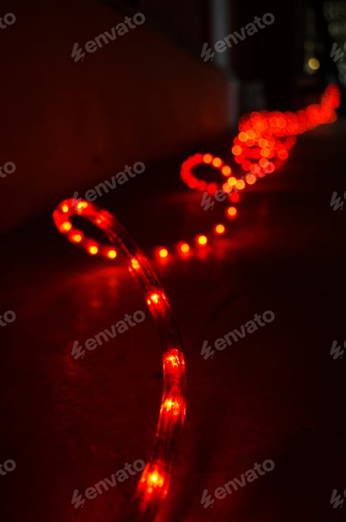 Preview: Closeup of the shiny red Led strip lights on the floor