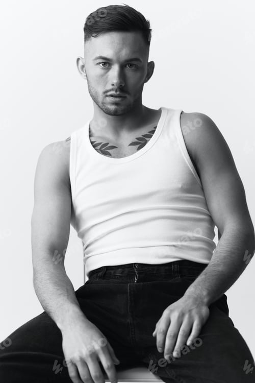Preview: Modelling snapshots. Serious self-confident attractive handsome man in basic white undershirt