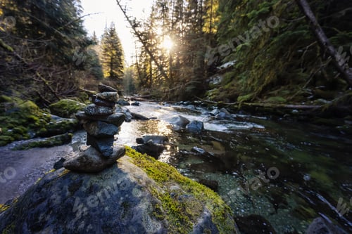 Preview: Stack of Rocks by the river in Canadian Nature during winter