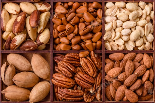 Preview: Box with various nuts cashew, macadamia, peanut, cedar, pecan, walnut, brazil, hazelnut