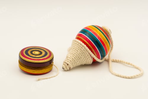 Preview: Colorful yo-yo and trompo on a white background