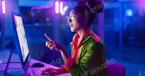Preview: Black woman, business and neon light in office and working on laptop to search or online for fashio