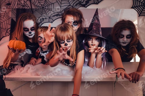 Preview: Children posing at counter and pulling their hands