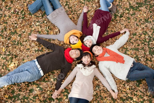 Preview: Friends Lying in a Star Shape Holding Hands