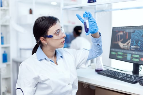 Preview: Close up of young doctor in biochemistry analysing genetic material