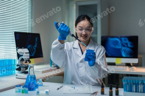 Preview: Asian female scientist working with pipette researching DNA in laboratory