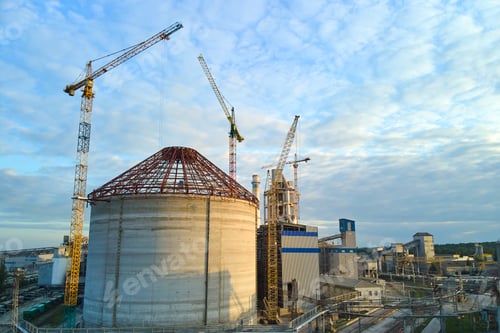 Preview: Aerial view of cement factory under construction with high concrete plant structure