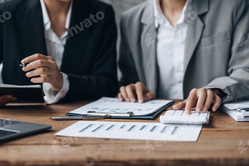 Preview: Company meeting room has businessmen and finance managers meeting together.