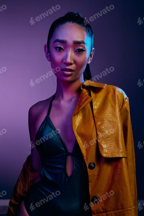 Preview: Woman attractive neon fashion makeup light asian purple trendy beauty disco colorful blue