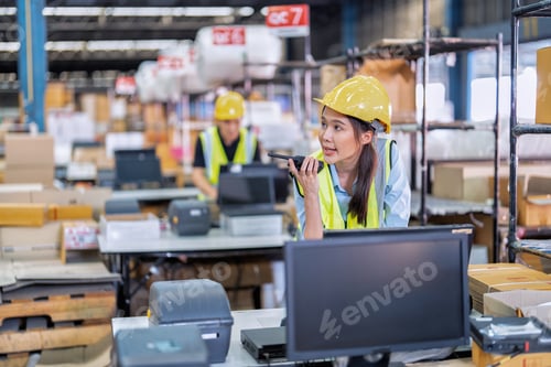 Preview: Worker working in the large depot storage warehouse concentrate check stock at cashier counter