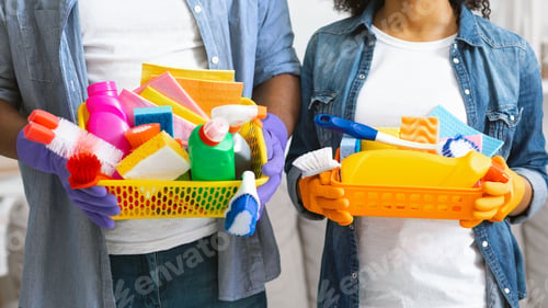 Preview: Buckets With Cleaning Supplies In Hands Of Unrecognizable Black Couple