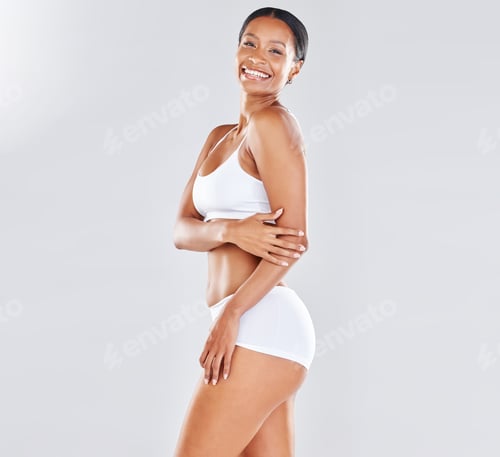 Preview: Black woman, healthy body and standing isolated on grey background with smile in underwear for skin