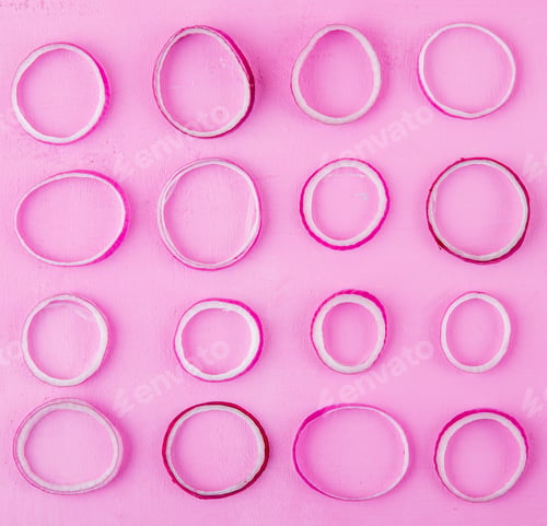 Preview: top view of pattern of slices of red onion on purple background