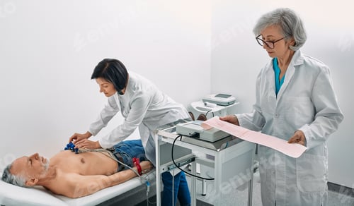 Preview: Cardiogram test. Elderly male patient receives heart rate monitored using electrocardiogram