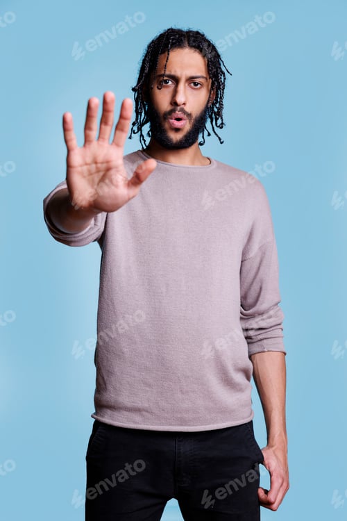 Preview: Man showing no gesture with hand, telling to stop