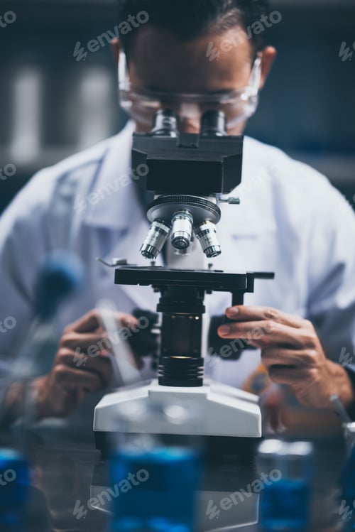 Preview: Close-up shot of microscope with metal lens at laboratory.