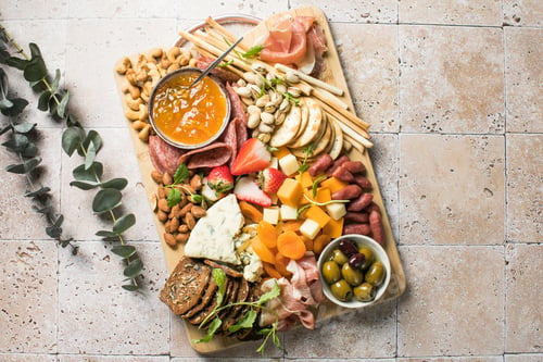 Preview: Antipasto meat board. catering platter with jamon, sausage and cheese. Food recipe background.